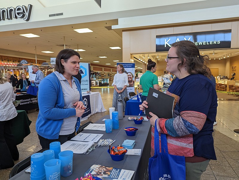 Ryan Pivoney/News Tribune
Ashley Anderson, a recruiter for the Missouri Department of Higher Education and Workforce Development, talks to Megan Cantlon about the department's open positions Wednesday during the state's spring hiring event at Capital Mall. The hiring event featured more than 20 state employers promoting career options and conducting on-site interviews.