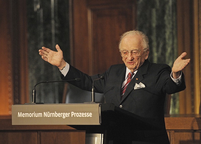 FILE - Benjamin Ferencz, Romanian-born American lawyer and chief prosecutor of the Nuremberg war crimes trials, speaks during an opening ceremony for the exhibition commemorating the Nuremberg war crimes trials in Nuremberg, Germany, Sunday, Nov. 21, 2010. Ferencz, the last living prosecutor from the Nuremberg trials, who tried Nazis for genocidal war crimes and was one of the first outside witnesses to document the atrocities of Nazi labor and concentration camps as a U.S. Army soldier, died Friday evening, April 7, 2023, in Boynton Beach, Fla.,, according to St. John's University law professor John Barrett, who runs a blog about the Nuremberg trials. He had just turned 103 in March. (Armin Weigel/Pool Photo via AP, File)