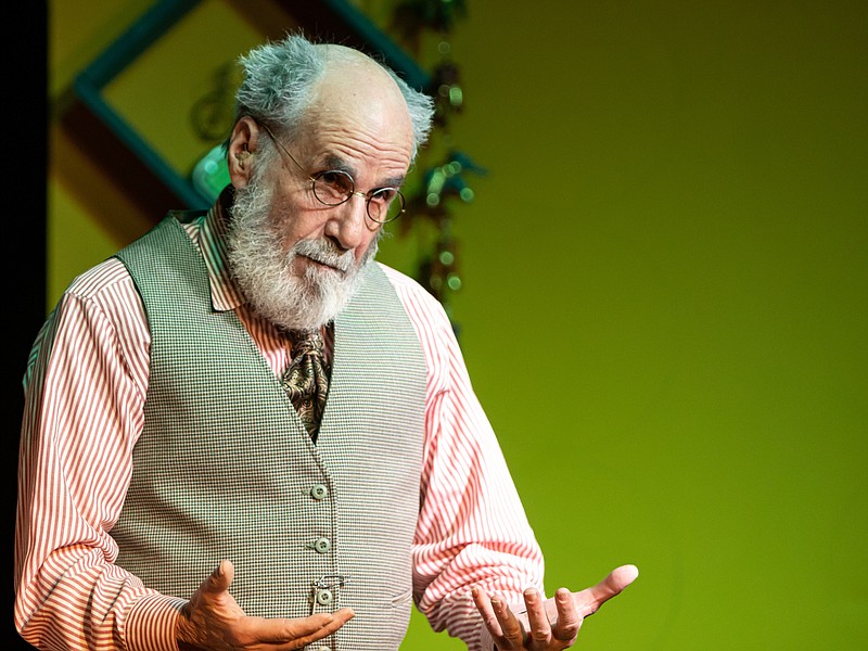 Josh Cobb/News Tribune photo: Stained Glass Theatre rehearses for the play The Giver on Tuesday evening, April 18, 2023.  Steve Feldman, as the Giver, tells Jonas about the time that an airplane flew over their community.