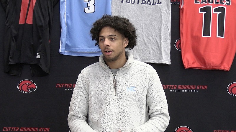 Cutter Morning Star senior KJ McDaniel speaks at a ceremony where he signed his letter of intent to play college basketball for National Park College Thursday. - Photo by Lance Porter of The Sentinel-Record