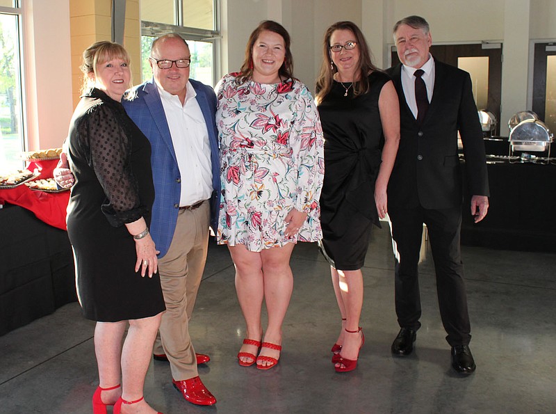 Kim Smith (from left), Bill Mathews, Emily Mathews and Lisa and Mark Harger help support Ronald McDonald House Charities Arkoma at the Red Shoe Soiree on April 14 at Heroncrest in Springdale.
(NWA Democrat-Gazette/Carin Schoppmeyer)