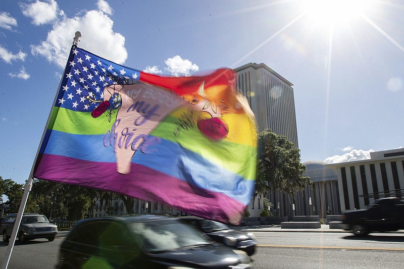 A flag that reads "my body, my choice," flutters in the wind across the street from Florida Capitol where the House voted ban abortions after six weeks on Thursday, April 13, 2023 in Tallahassee, Fla. The Republican-dominated Florida Legislature on Thursday approved a ban on abortions after six weeks of pregnancy, a proposal supported by GOP Gov. Ron DeSantis as he prepares for an expected presidential run. (Alicia Devine/Tallahassee Democrat via AP)