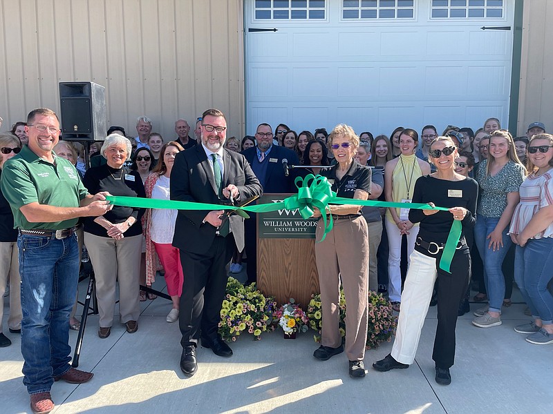 Photo courtesy William Woods University
William Woods University President Jeremy Moreland cuts a ribbon to celebrate the opening of the Center for Equine Medicine on Friday. From left to right: Moreland, WWU equestrian professor Gayle Lampe and WWU trustee Deborah Hutchinson.