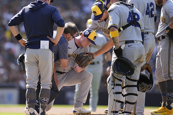 The San Diego Padres' Manny Machado is congratulated by teammate