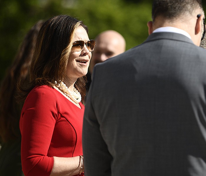 Kristi Putnam, Secretary of the Department of Human Services, talks with State Drug Director Thomas Fisher, II before the start of the Save AR Students event on the steps of the State Capitol on Monday, April 17, 2023. Roughly 50 people came to the event to raise awareness of drug use among students.

(Arkansas Democrat-Gazette/Stephen Swofford)