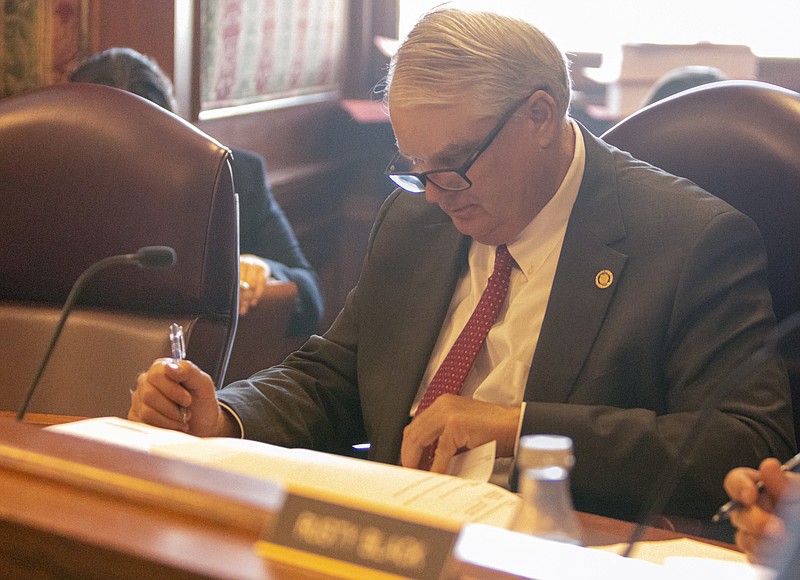 Josh Cobb/News Tribune photo: State Sen. Jason Bean, a Holcomb Republican, looks over a Missouri House bill during the Senate Appropriations Committee hearing at the state Capitol on Tuesday afternoon, April 18, 2023.