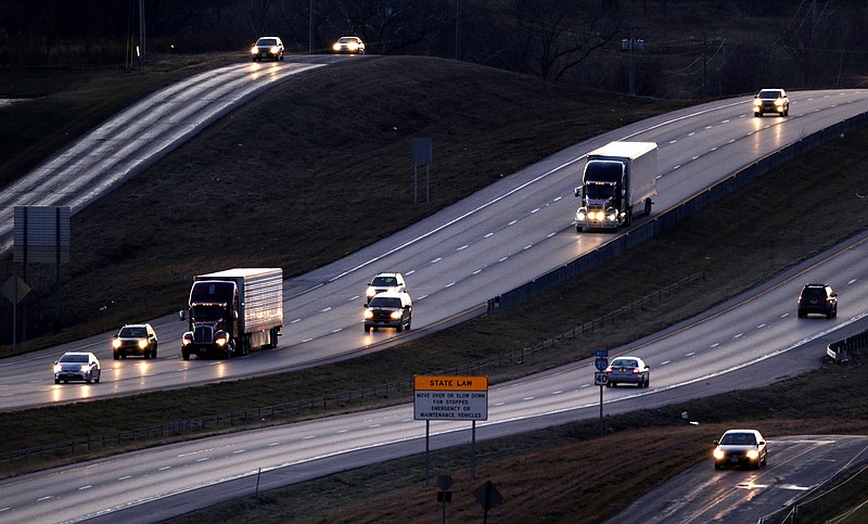 FILE - Vehicles travel along Interstate 70 near Odessa, Mo., Jan. 14, 2016. (AP Photo/Charlie Riedel, File)