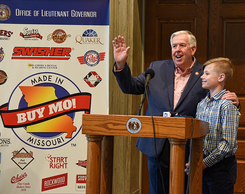 Julie Smith/News Tribune photo: 
Gov. Mike Parson called Drew Heslop forward while addressing members of Buy Missouri who were at the state Capitol Wednesday, April 19, 2023, for Buy Missouri Showcase Day. Heslop's family owns Rockwood Charcoal and was in the House Lounge for the greeting by the governor and Lt. Gov. Mike Kehoe prior to the opening of the showcase in the third floor rotunda. Rockwood was one of nearly three dozen vendors displaying their wares or services to visitors in the Capitol.