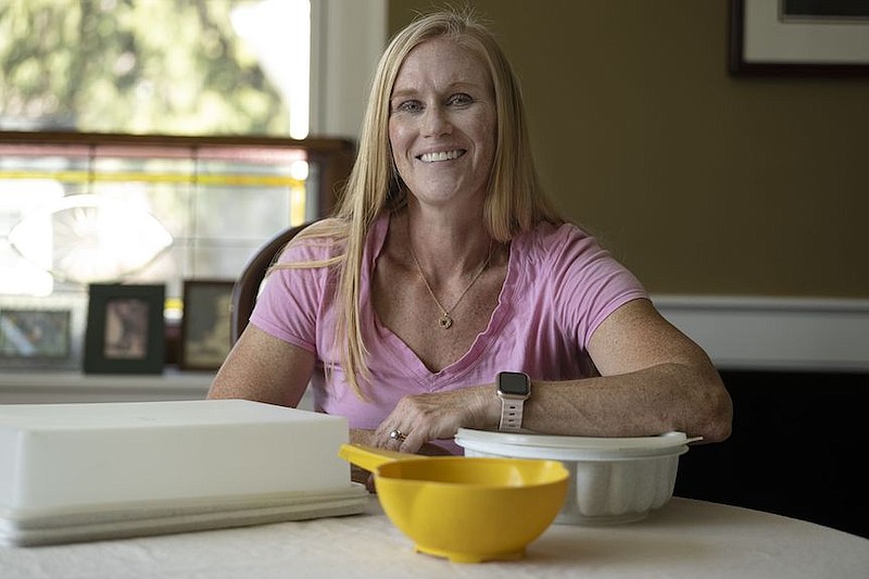 Lisa Wolverton, a personal trainer from Ardmore, still owns three pieces of Tupperware, including a yellow juicer she uses each day. (Jose F. Moreno/The Philadelphia Inquirer/TNS)