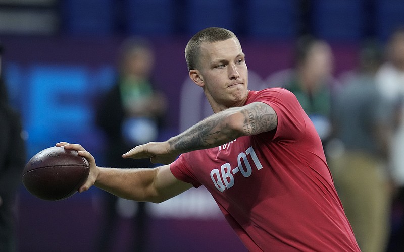 FILE - Shepherd quarterback Tyson Bagent runs a drill at the NFL football scouting combine in Indianapolis, Saturday, March 4, 2023. Bagent played most of his college career in relative obscurity at Division II Shepherd College in West Virginia. (AP Photo/Michael Conroy, File)