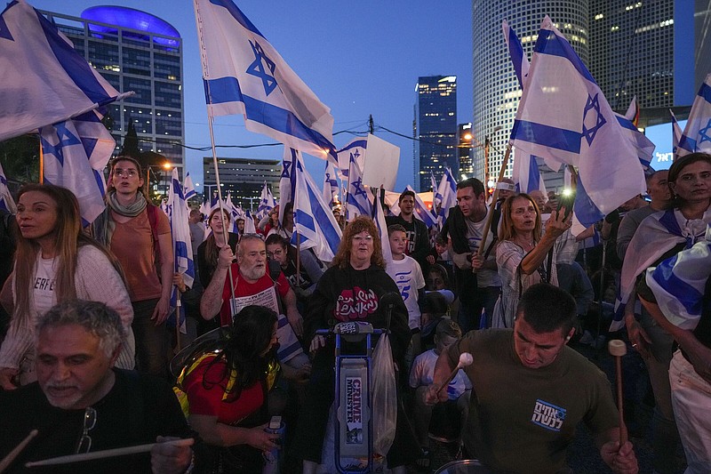 Israelis protest against plans by Prime Minister Benjamin Netanyahu's government to overhaul the judicial system in Tel Aviv, Israel, Saturday, April 22, 2023. (AP Photo/Tsafrir Abayov)