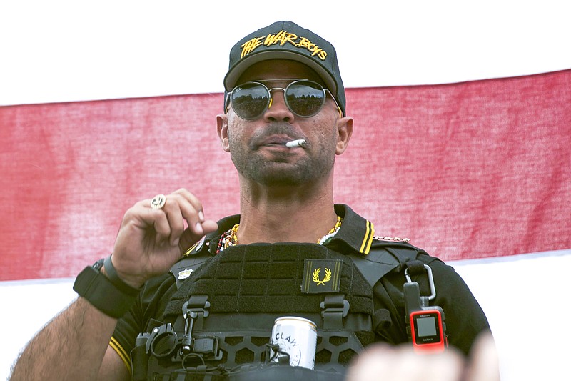 FILE - Proud Boys leader Henry &quot;Enrique&quot; Tarrio wears a hat that says The War Boys during a rally in Portland, Ore., Sept. 26, 2020. A federal jury is set to hear closing arguments in the historic trial of Proud Boys extremist group leaders charged with plotting to use force to keep former President Donald Trump in power. Starting Monday, April 24, 2023, prosecutors and defense lawyers will make their final appeals to jurors who will decide the fate of former Proud Boys national chairman Enrique Tarrio and four lieutenants. (AP Photo/Allison Dinner, File)