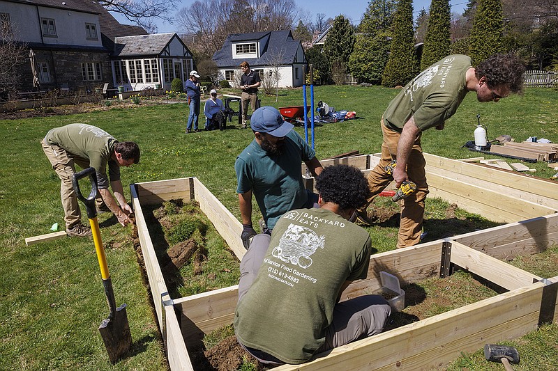 Workers with Backyard Eats built raised vegetable garden beds for the Podrazas of Wyndmoor. The Podrazas will be planting themselves, but across the city, Backyard Eats builds, maintains, waters and even picks kitchen vegetables for clients. (Alejandro A. Alvarez/The Philadelphia Inquirer/TNS)