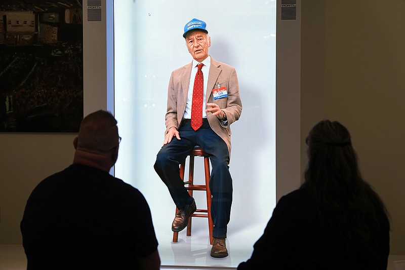 An interactive holographic image of Sam Walton is pictured in the Walmart Museum Heritage Lab Wednesday, April 19, 2023, in Bentonville, Ark. (AP Photo/Sue Ogrocki)