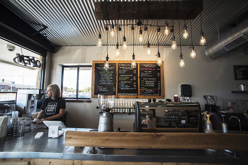 NWA Democrat-Gazette/SPENCER TIREY     
Amy Ferguson owner of Heroes Coffee Company work, Tuesday Aug. 29, 2017, on getting the new location setup for it's Friday opening at 8th and SW A Street in Bentonville. They are renovating what used to be an E-Z Mart gas station.