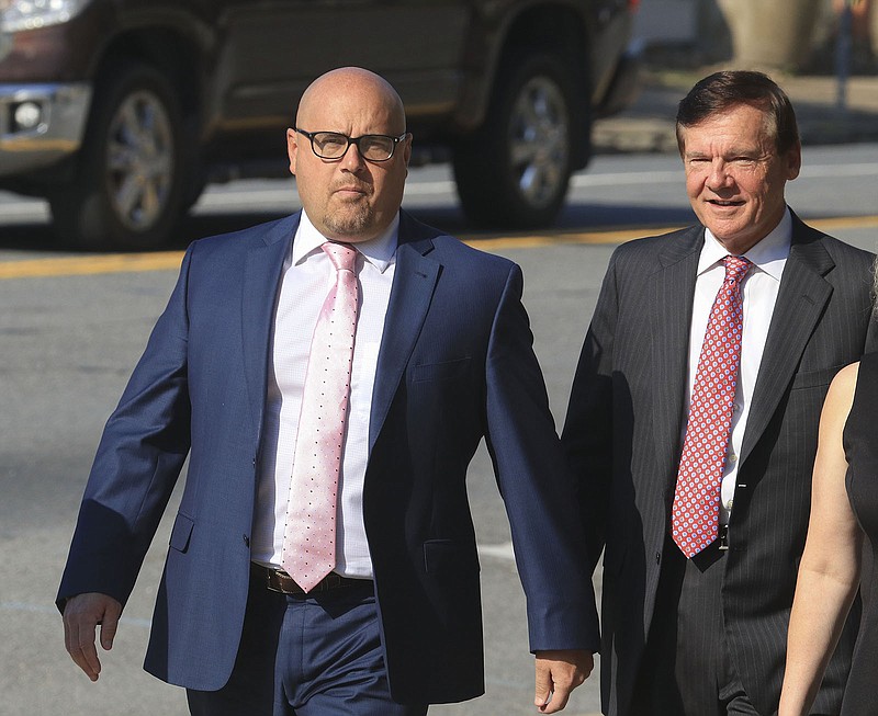 Arkansas Democrat-Gazette/STATON BREIDENTHAL --9/18/18-- Former Arkansas Sen. Jeremy Hutchinson (left) arrives Tuesday morning at the federal courthouse in Little rock with his father, former U.S. Sen. Tim Hutchinson. Hutchinson plead not guilty to 12 counts of wire and tax fraud.