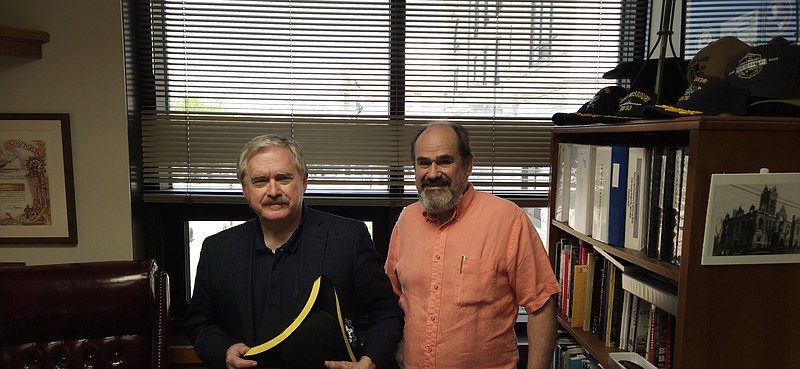 Alex Naughton/News Tribune photo: Sam Bushman and Cliff Olsen stand in Bushman's office at the Cole County Courthouse Annex. Bushman has a tri-point hat in hand.