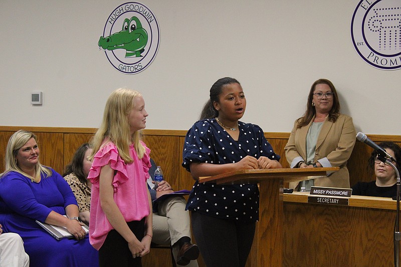 Washington Middle School 6th graders Kate Lee, left, and Avery Warren tell the El Dorado School Board about their recent experience at the National Amazing Shake competition. (Caitlan Butler/News-Times)