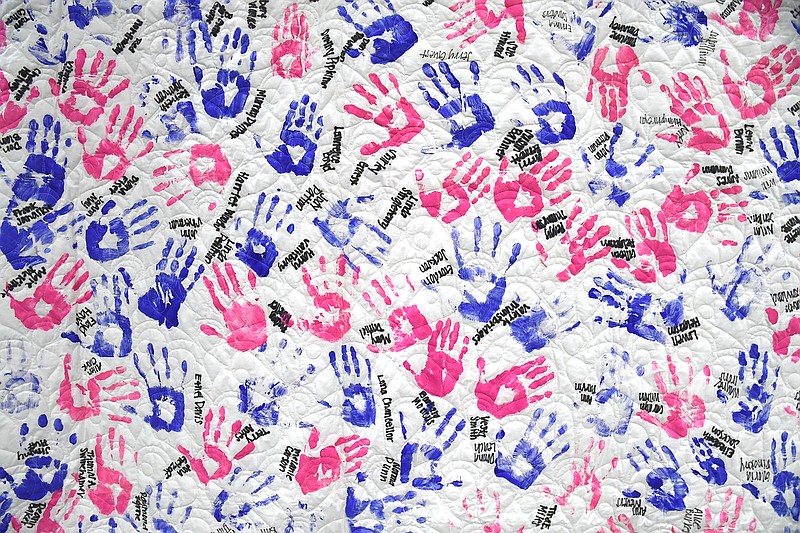 A survivor quilt is displayed at Bank OZK Arena during Relay for Life on April 14. - Photo by Lance Brownfield of The Sentinel-Record