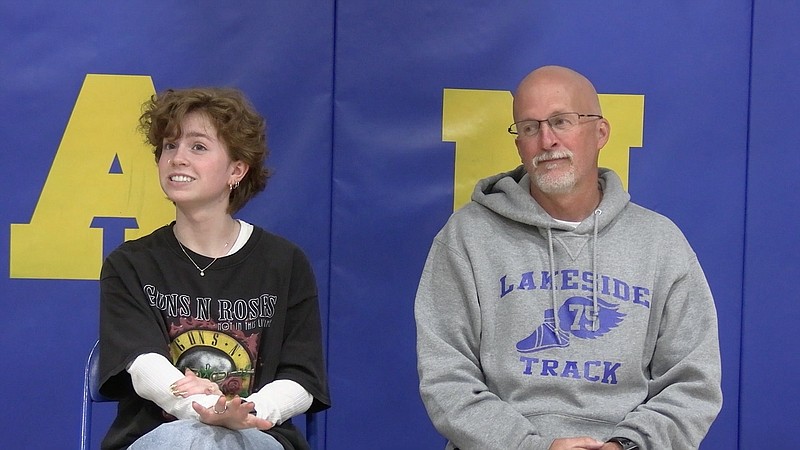 Lakeside senior diver Anna Lewis and head dive coach Jeff Haynes speak at Lakeside Thursday. - Photo by Lance Porter of The Sentinel-Record