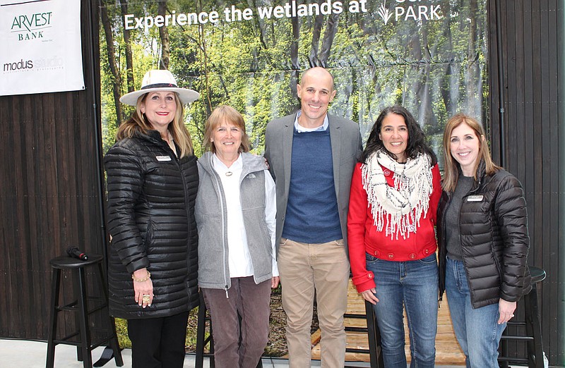 Debra Layton, Peel Compton Foundation executive director (from left); Sandi Formica, Watershed Conservation Resource Center executive director; Michael Pope, Modus Studio associate architect;
Samantha Best, Crystal Bridges Museum of American Art landscape and outdoor experience manager; and Kelly Kemp-McLintock, Peel Compton Foundation interim director of development help welcome guests to Osage Park After Dark on April 22 at the park in Bentonville.
(NWA Democrat-Gazette/Carin Schoppmeyer)