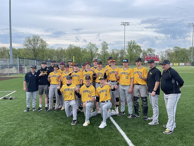 The Fulton Hornets baseball team poses for a photo after beating rival Mexico to win the North Central Missouri Conference for the first time in 22 years Friday at Mexico High School in Mexico, Missouri. (Fulton Sun/Robby Campbell)