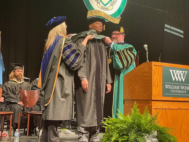 Photo courtesy William Woods University: 
William Woods University Provost Aimee Sapp (left) and President Jeremy Moreland (right) present commencement speaker Byron Bagby with an honorary doctorate degree. Bagby is a retired Major General in the U.S. Army and graduate of Westminster College.
