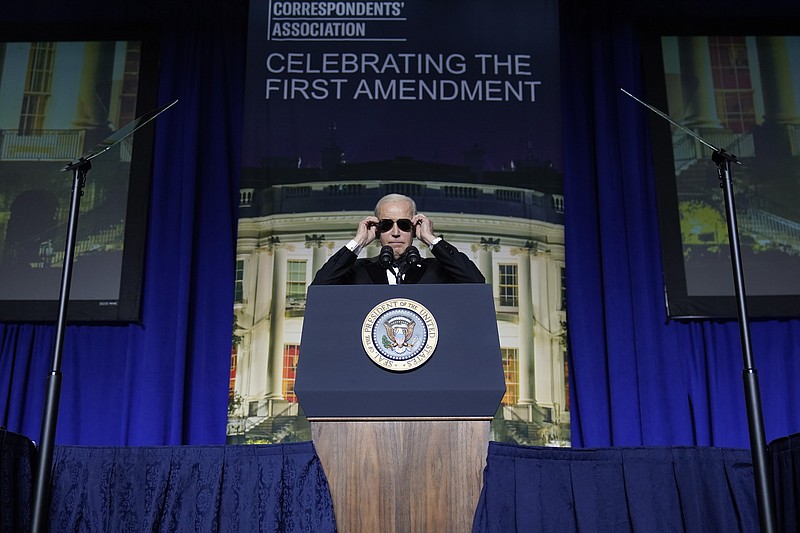 President Joe Biden puts on sunglasses after making a joke about becoming the "Dark Brandon" persona during the White House Correspondents' Association dinner at the Washington Hilton on Saturday, April 29, 2023, in Washington. (AP Photo/Carolyn Kaster)