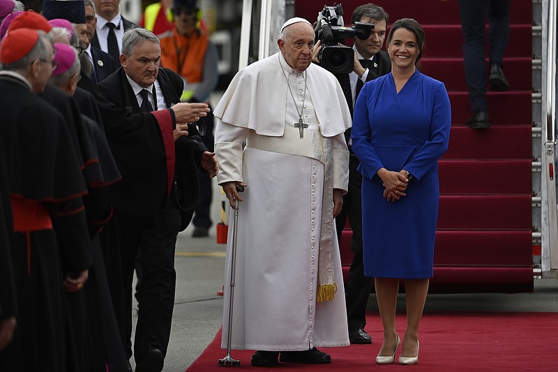 Pope Francis is greeted by Hungary President Katalin Novak during the farewell ceremony at the Budapest International Airport on Sunday, April 30, 2023, in Budapest, Hungary. (AP Photo/Denes Erdos)