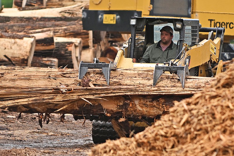 A heavy machinery operator works Wednesday, April 26, 2023 to move large parts of trees that were damaged by the March 31 tornado that tore through Burns Park in North Little Rock.
(Arkansas Democrat-Gazette/Staci Vandagriff)