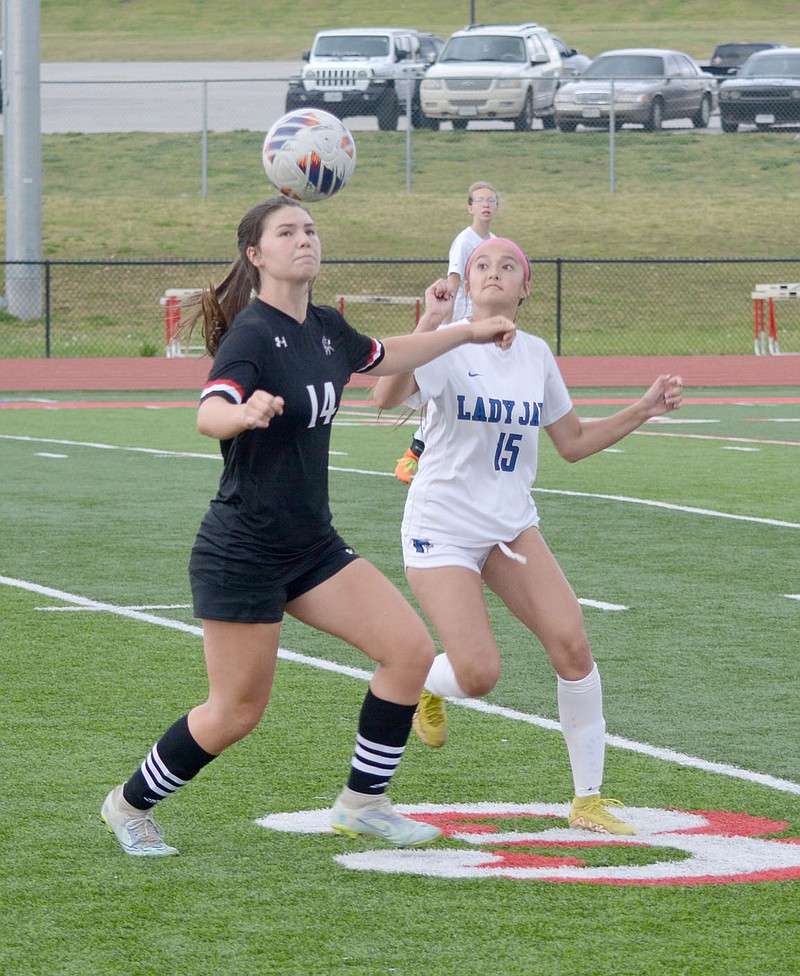 Graham Thomas/McDonald County Press
McDonald County's Anna Clarkson battles a Marshfield defender for the ball during a girls soccer game on Thursday, April 27, in Anderson. Marshfield defeated the Lady Mustangs 8-0.