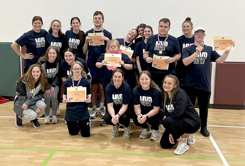 Graham Thomas/Herald-Leader
Members of the John Brown University women's basketball team pose with participants of Ability Tree's MVP Basketball League after the fourth and final session on April 26 at Ability Tree in Siloam Springs.