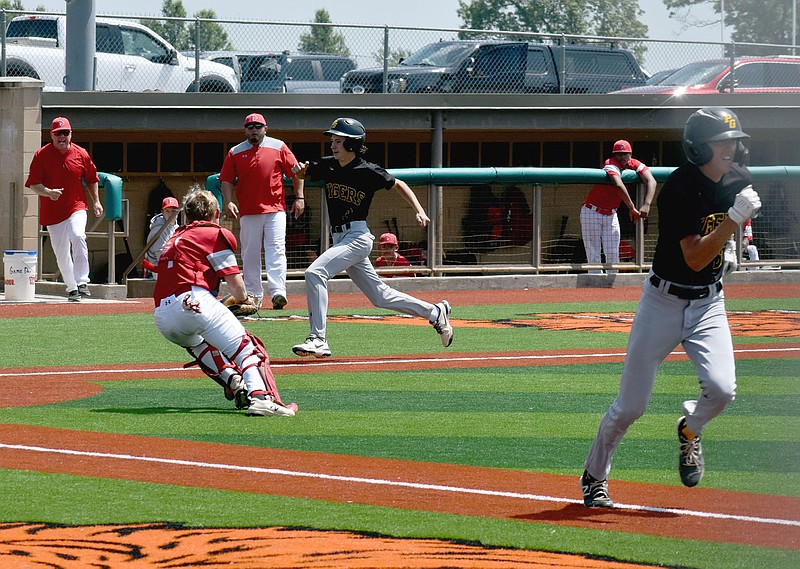 Mark Humphrey/Enterprise-Leader
Prairie Grove junior Asher Linn scores on a bunt by senior Tate Benoit during the Tigers' 6-5 loss to Dardanelle in the regional semifinal Saturday. Prairie Grove rebounded to defeat Morrison, 7-2, in the 4A North Regional baseball consolation game Saturday afternoon. Prairie Grove begins state tournament play on Thursday against Arkadelphia at 12:30 p.m. at Lonoke.