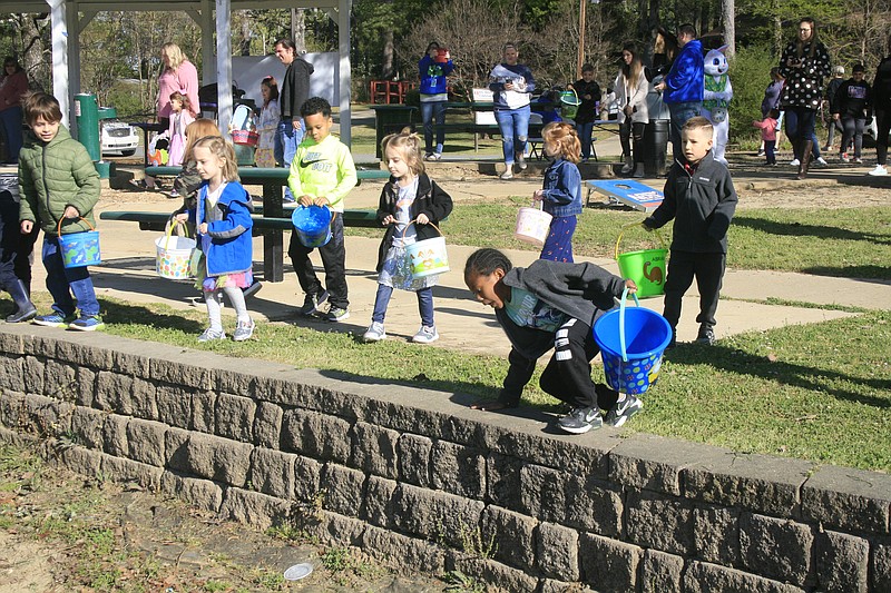Local children participate in an Easter egg hunt at Old City Park in this News-Times file photo. Mulch was laid at Old City Park in February ahead of the Arkansas Governor's Conference on Tourism, one of several minor upgrades to local parks made in recent months.