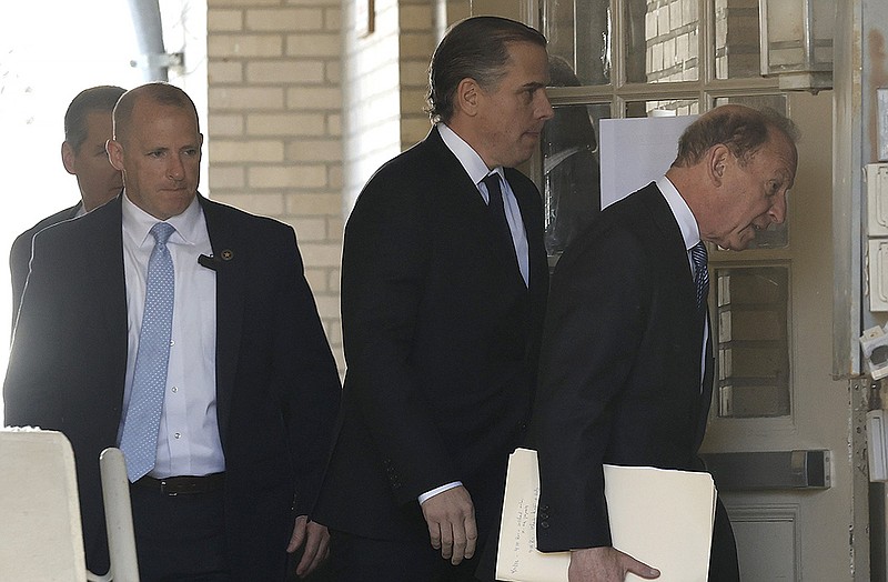 Hunter Biden (right center) and his attorney Abbe Lowell (right) enter the Independence County Courthouse in Batesville on Monday, May 1, 2023, in his child support and paternity case. 
(Arkansas Democrat-Gazette/Thomas Metthe)