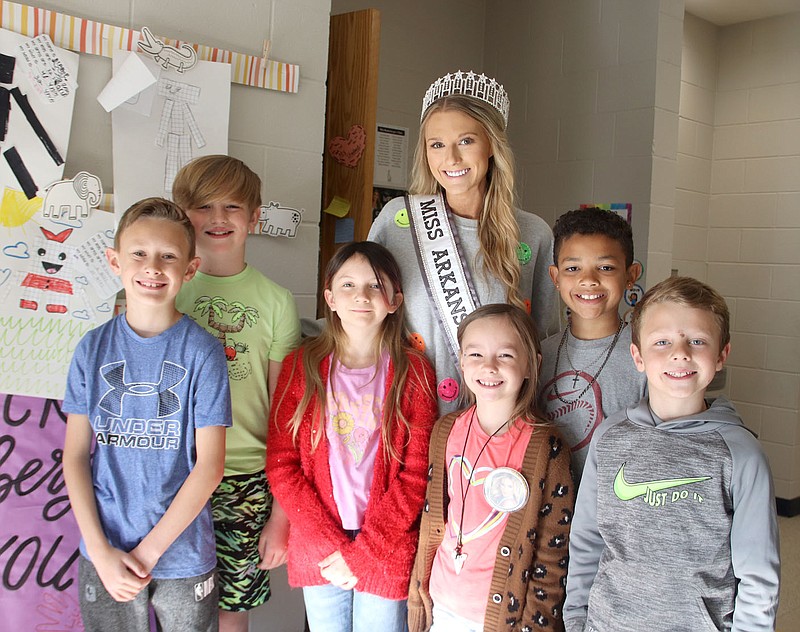Lynn Kutter/Enterprise-Leader
Mackenzie Hinderberger, a first-year teacher at Folsom Elementary School in Farmington, stands with some of her third grade students. "Miss H," as her students call her, was crowned Miss Arkansas USA on April 30 in Fort Smith. Hinderberger represented Farmington in the pageant.
