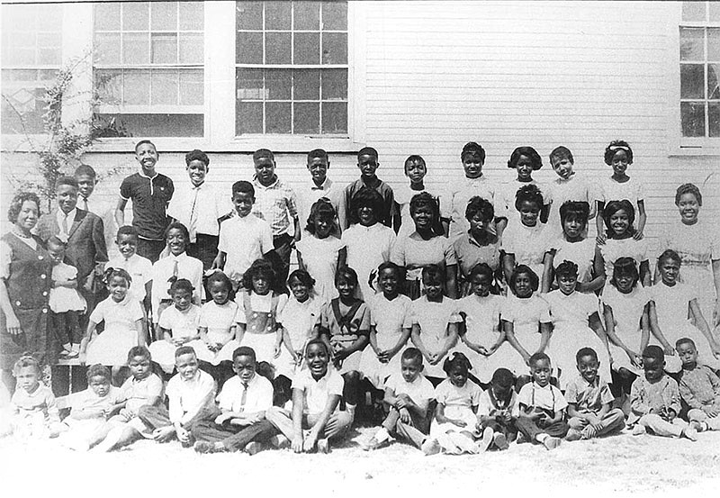 Class at the Rosenwald School at Bigelow (Perry County); circa 1960. Top Row: Glen Tillman, Clayton Davie, Nathaniel Evens Jr, W. C. Ratliff, Ruby Mack, Walter Ratliff, Verna Keith, Juanita Casey, Sandra Evans, Doris Davie, Linda Mack. 2nd Row: Willie Davie, Dorie Fules, Stanley Mack, Marshall Evens, Clarence Mack, Peggy Evens, Carolyn Evens, Dorthy Casey, Melva Tillman, Emma Mack, Evelyn Malcum, Edna Gray. 3rd Row: Sue Mack, Darlene Mack, Diane Keith, Clementine Evens, Shelain Turner, Myra Malcum, Jannette Keith, Doris Fules, Cynthia Tillman, Elnora Ratliff, Sheila Fletcher, Kathy Evens, Louise Tillman. Bottom Row: Ivy Gray, Pamella Casey, Ray Glen Davie, Dale Talley, Ira Casey, Pat Mack, Ada Ratliff, Wardell Ratliff, Earl Evens, William Evans, Kenneth Malcum, Gary Harris.
(Courtesy of the Butler Center for Arkansas Studies, Central Arkansas Library System)