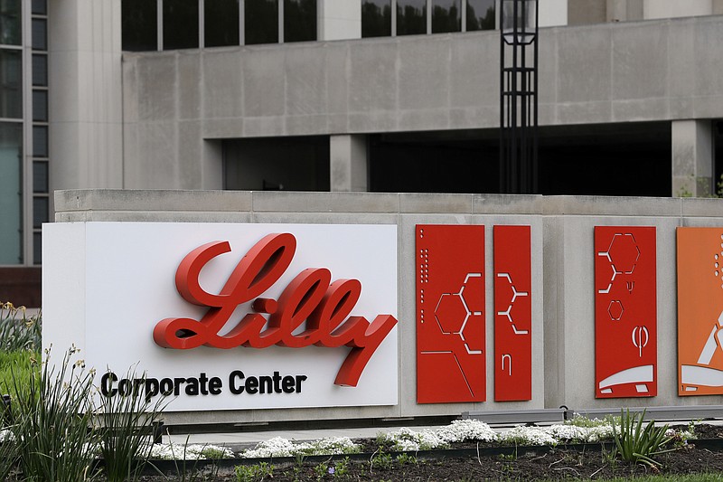 A sign for Eli Lilly & Co. sits outside their corporate headquarters in Indianapolis on April 26, 2017. The company said Wednesday, May 3, 2023, that its experimental Alzheimers drug appeared to slow worsening of the mind-robbing disease in a large study. (AP Photo/Darron Cummings, File)