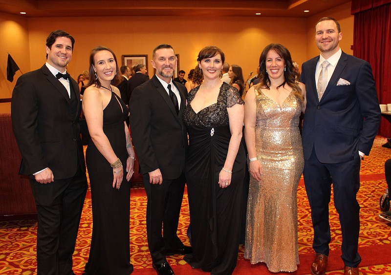 Tim Cumming and Adele O'Rourke, Law Enforcement Sheep Dog of the Year (from left); Mike and Jackie Miller; and Cassie Christy, Fire & Rescue Sheep Dog of the Year, and Nick Caruso stand for a photo at the Sheep Dog Impact Assistance Heroes Gala VIP reception April 22 at the Rogers Convention Center. 
(NWA Democrat-Gazette/Carin Schoppmeyer)