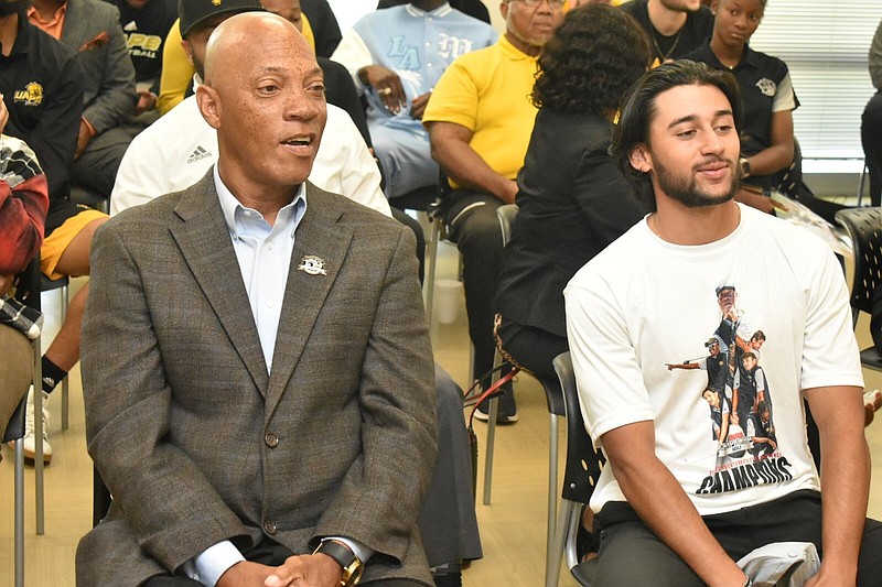 UAPB head coach Roger Totten and golfer Angel Perez await their team being announced for an NCAA regional tournament during a watch party on campus Wednesday. (Pine Bluff Commercial/I.C. Murrell)
