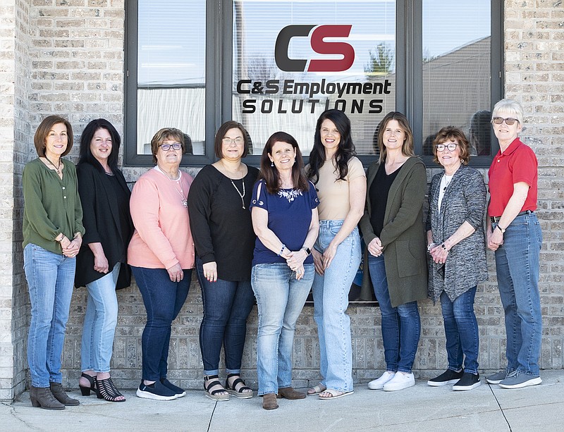 C&S staff members pose by the new logo. The staffing service just rebranded as C&S Employment Solutions. (Provided/C&S Employment Solutions)