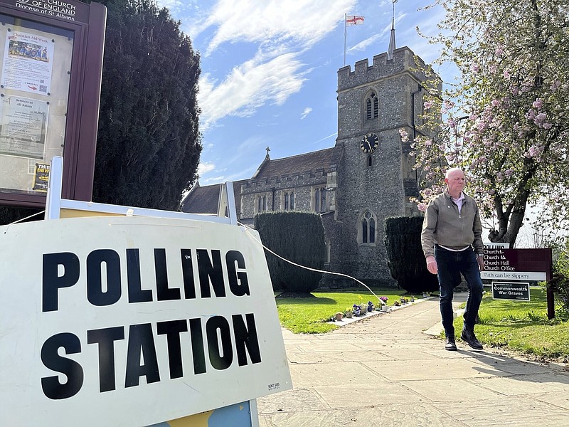 People outside the polling station in Kings Langley, England, Thursday, May 4, 2023. Millions of people in England are voting Thursday in local elections, the first test of electoral opinion since Prime Minister Rishi Sunak took over a fractious and exhausted Conservative Party six months ago. (Harry Stedman/PA via AP)