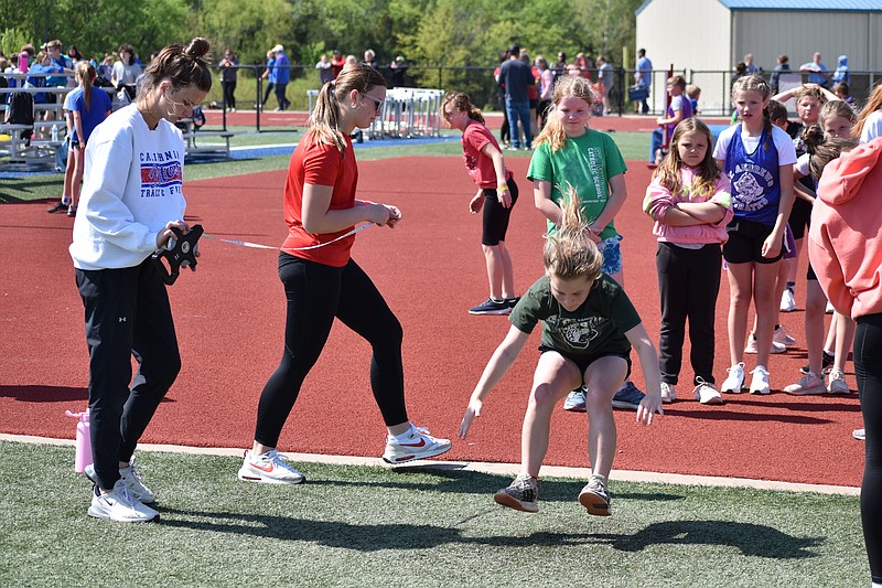 Democrat photo/Garrett Fuller — A student from St. Martins Catholic School competes Friday (May 5, 2023,) in the fourth-grade girls' long jump at the 34th annual Lions Club Track and Field Meet at California High School.