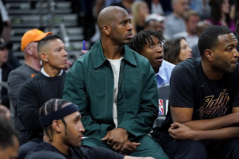 Phoenix Suns guard Chris Paul watches from the Benc hduring the first half of Game 3 of an NBA basketball Western Conference semifinal game against the Denver Nuggets, Friday, May 5, 2023, in Phoenix. (AP Photo/Matt York)