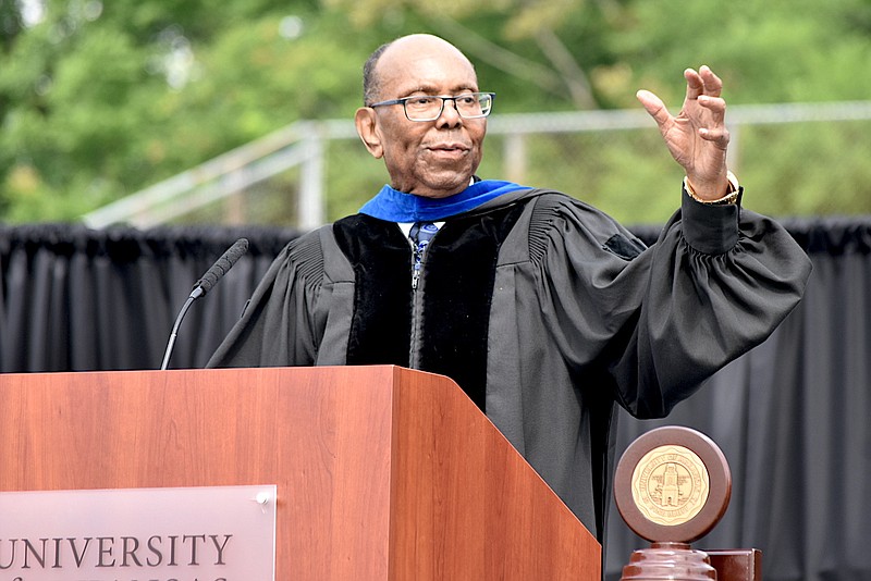 Businessman and philanthropist William F. Pickard discusses the importance of vision with UAPB graduates during the commencement address Saturday at Simmons Bank Field at Golden Lion Stadium. (Pine Bluff Commercial/I.C. Murrell)