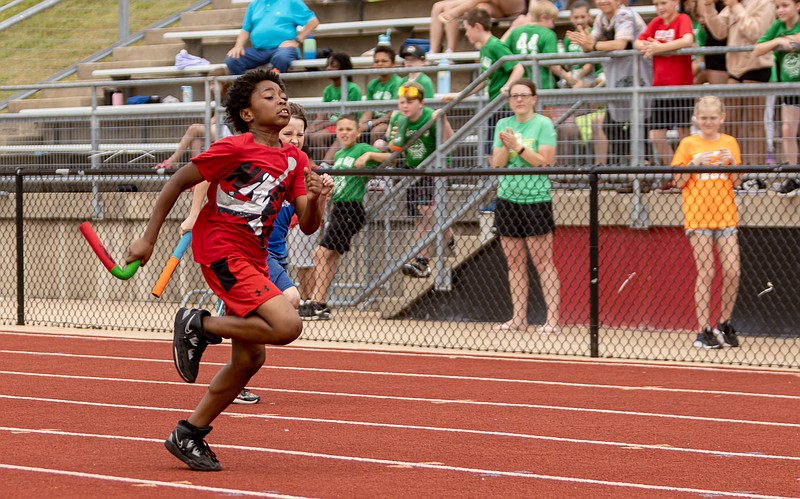 Josh Cobb/News Tribune photo: Kaiveon Terril sprints ahead of the competition while running his leg of the 60 meter relay Saturday, May 6, 2023, during the Little Olympics track meet at Adkins Stadium in Jefferson City. The Little Olympics is a free track meet held for fourth and fifth graders from the Jefferson City area that has been held for 73 years.