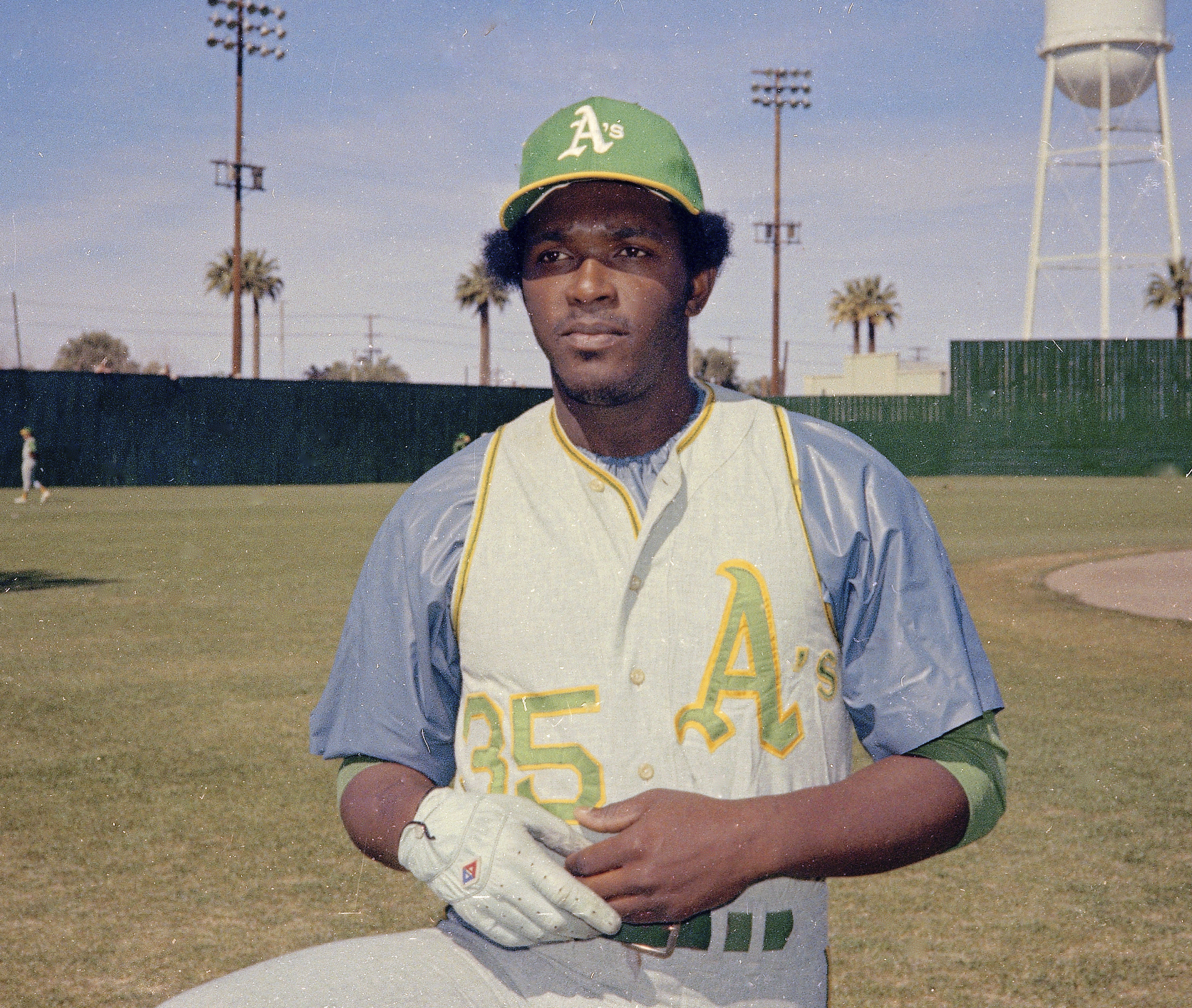 Former Oakland Athletics player Reggie Jackson throws out the ceremonial  first pitch after a ceremony honoring the Athletics' 1973 World Series  championship team before a baseball game between the Athletics and the