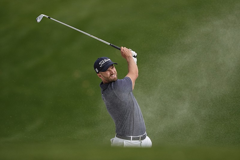 Wyndham Clark hits from a bunker on the 15th hole during final round of the Wells Fargo Championship golf tournament at the Quail Hollow Club on Sunday, May 7, 2023, in Charlotte, N.C. (AP Photo/Chris Carlson)