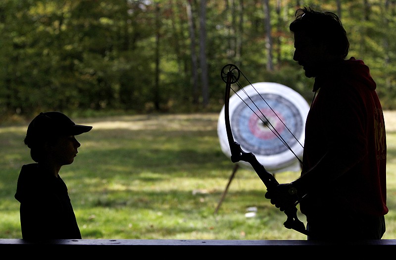 A Boy Scout listens to an archery instructor at Camp Minsi in Pocono Summit, Pa., in October 2009. (AP file photo/Carolyn Kaster, File)