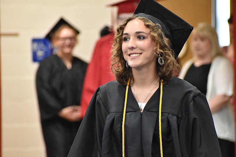 Democrat photo/Garrett Fuller — Hailey Milne, a 2023 Prairie Home graduate, turns the corner to find her seat Sunday (May 7, 2023,) after entering the gymnasium for the graduation ceremony at Prairie Home R-V School.